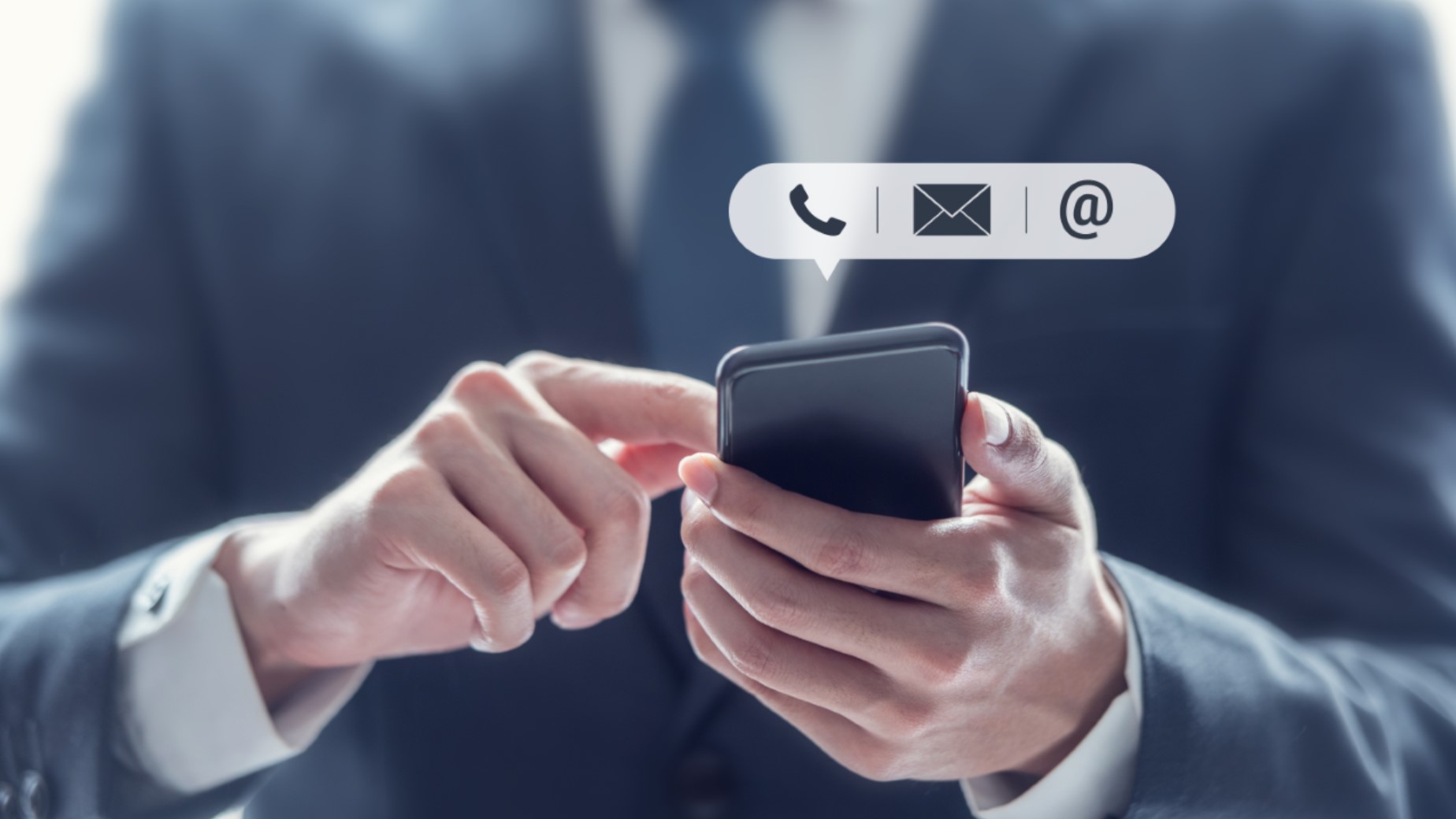 Business person using their smartphone to contact business partner