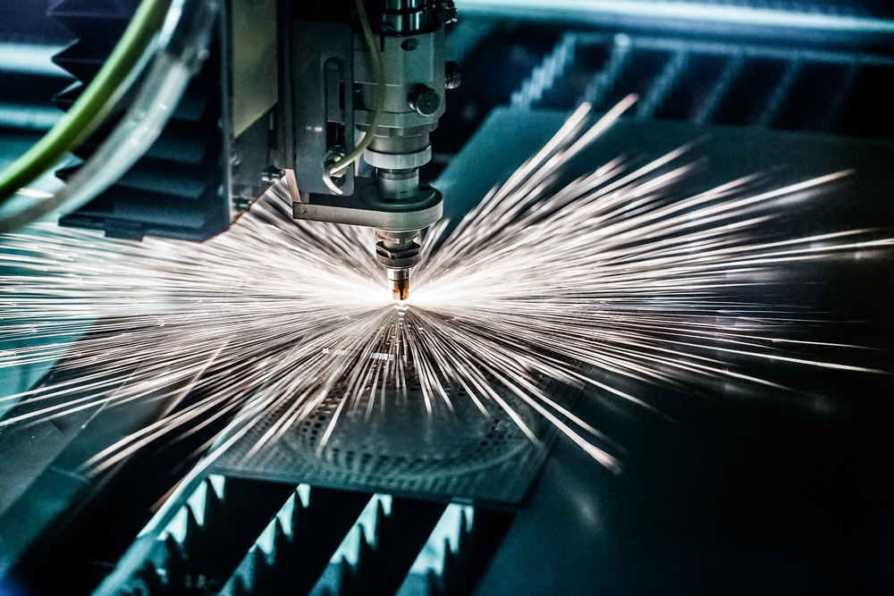 Photo of a laser welding metal, emitting many bright sparks