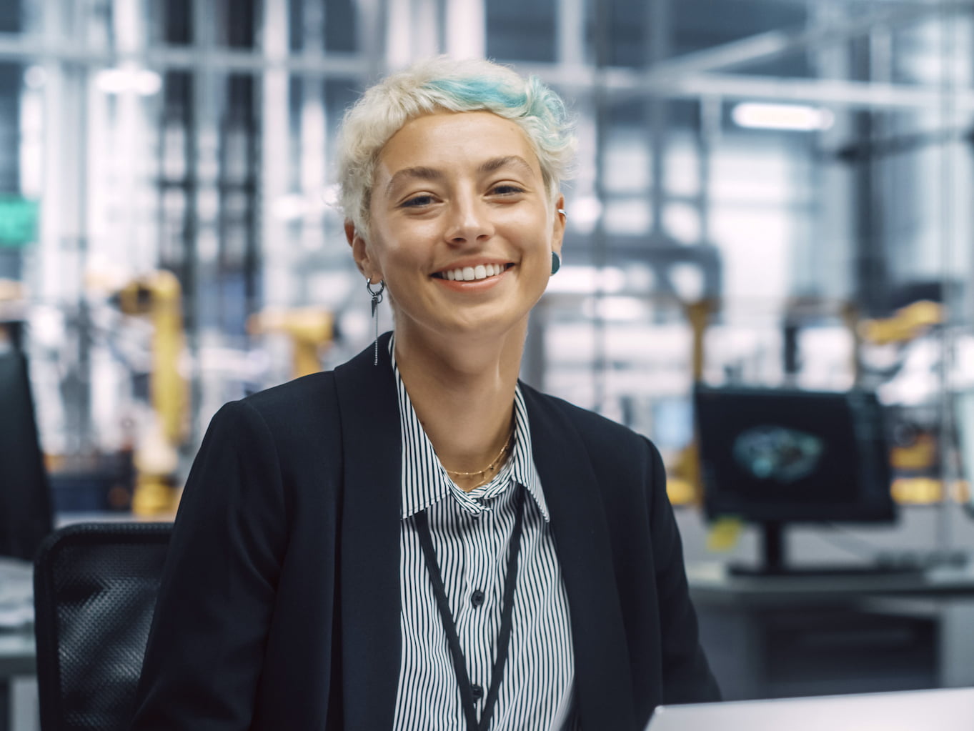 Young woman in a business suit smiling at the camera