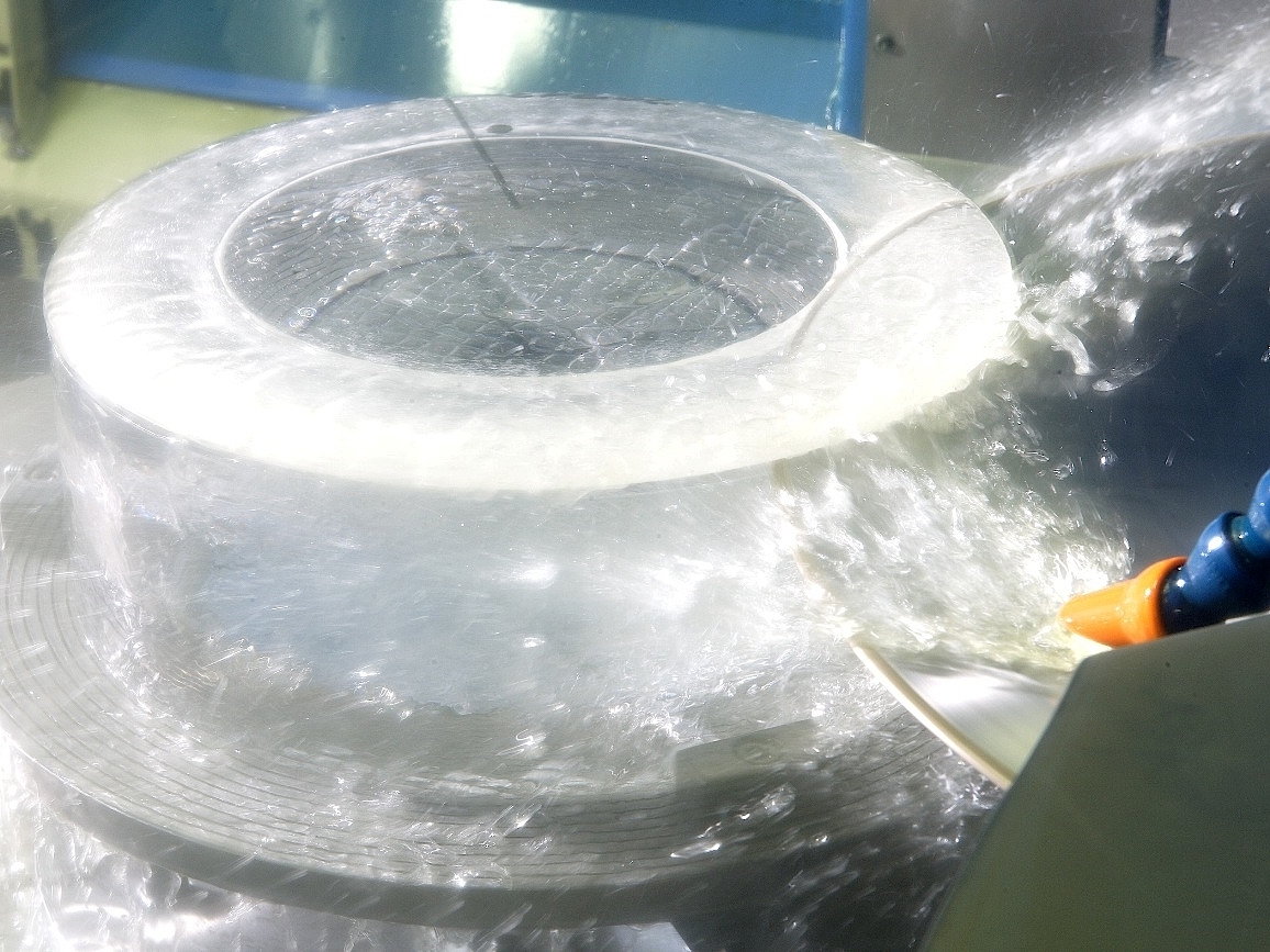 Large Disc Saw cutting a thin ring of fused silica from a large hollow cylinder