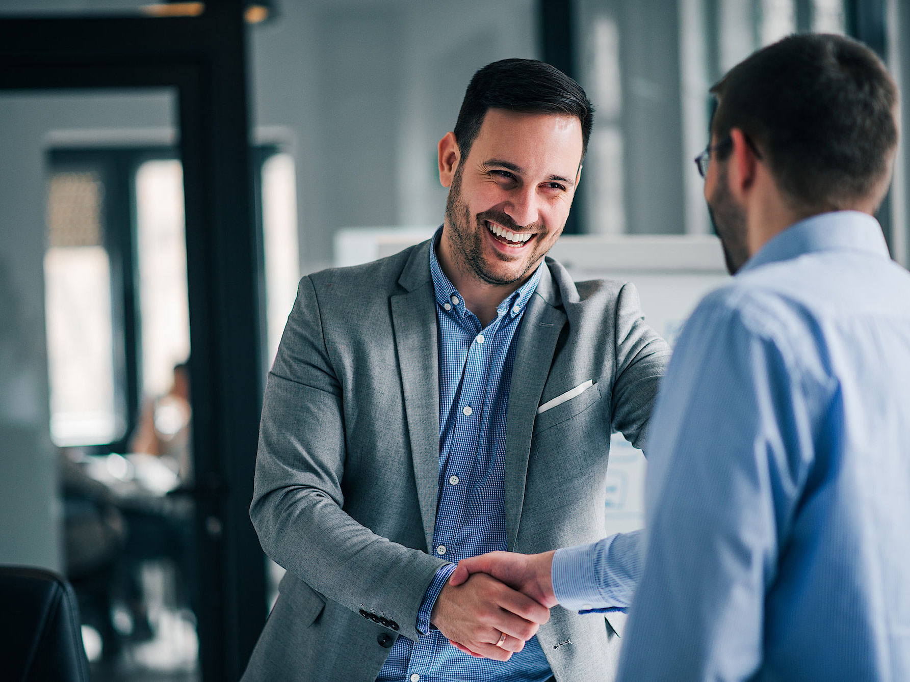 Two business men shaking hands